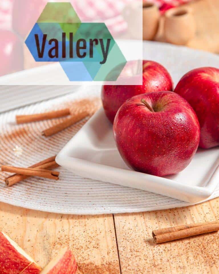 Red Apples on a Ceramic Plate Near Cinnamon Sticks