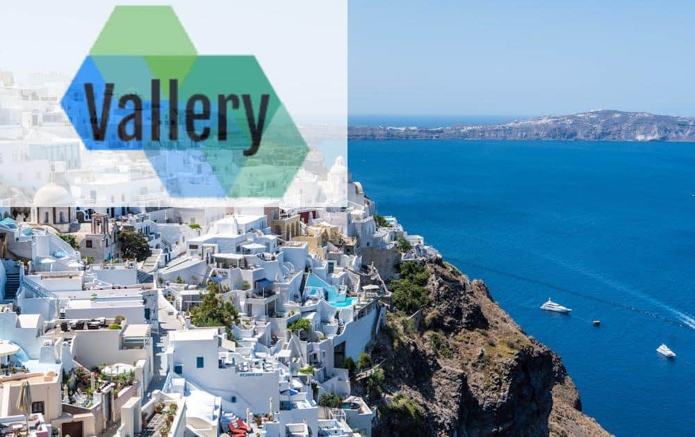 Beautiful Santorini houses overlooking the Aegean Sea on a sunny day.