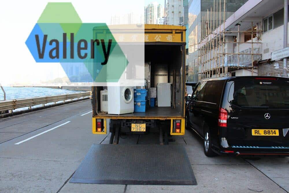 Photo by Théo Dorp white front-load washer in yellow delivery truck